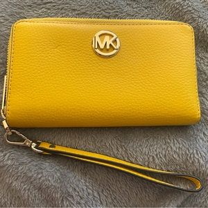 Michael Kors wristlet wallet in vibrant yellow
